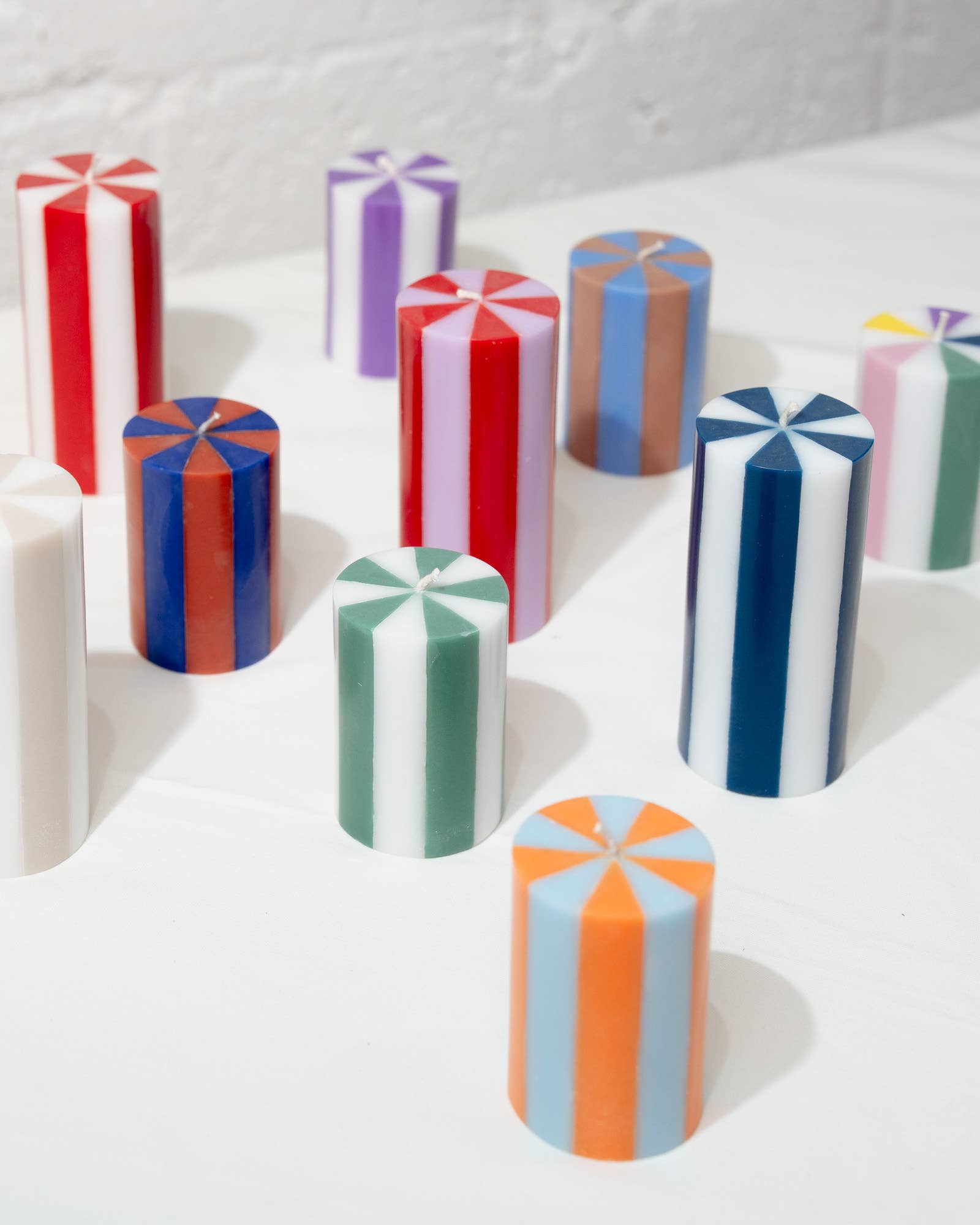 Medium Stripe Pillar Candle in Racing Red in Green