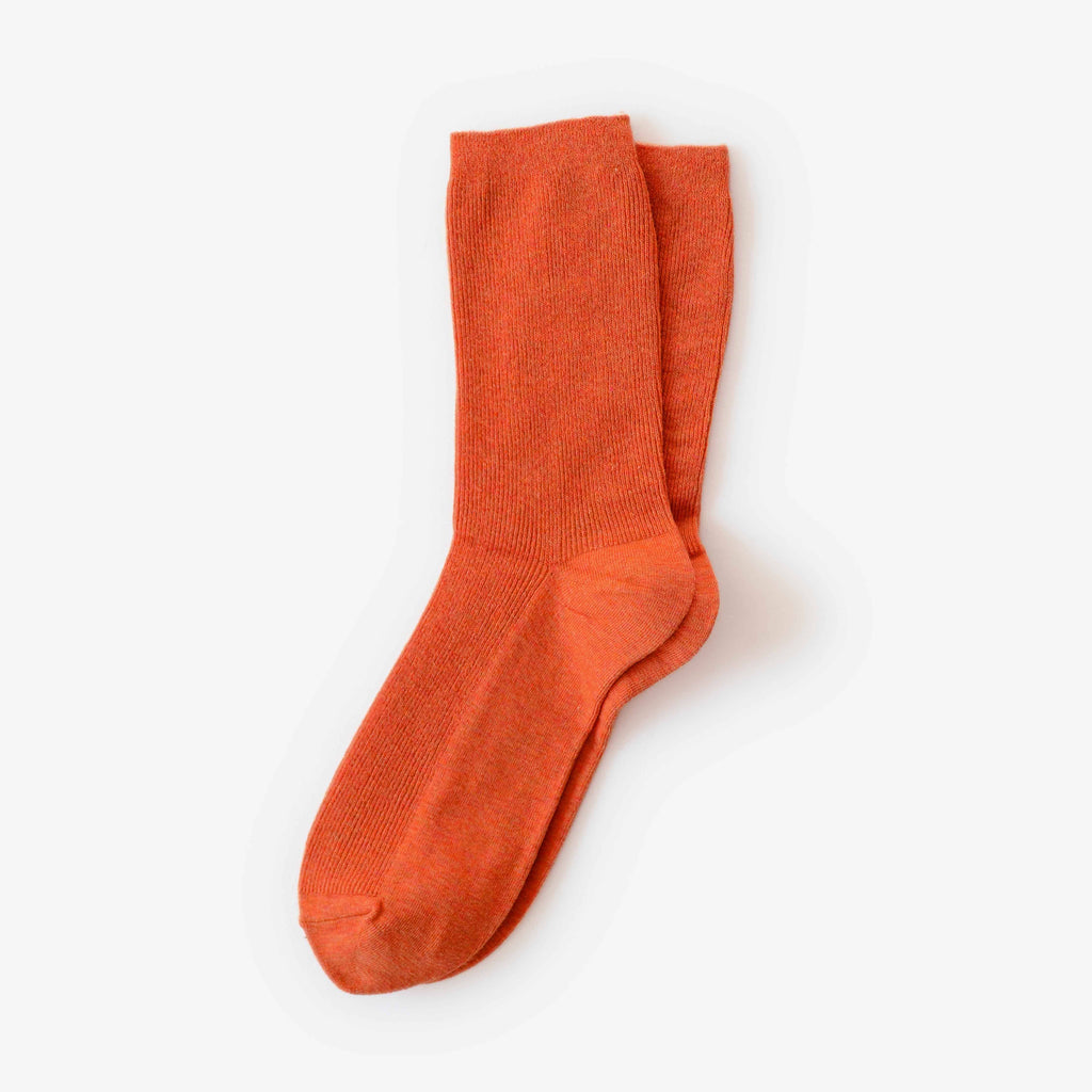 Orange sock on a white background
