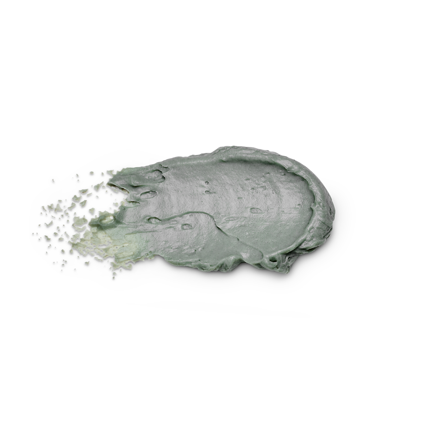 A thick, textured smear of sage green cosmetic cream or clay mask on a solid white background, with fine particles visibly splashing from the left side.