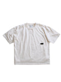 White t-shirt with a small black logo on a white background