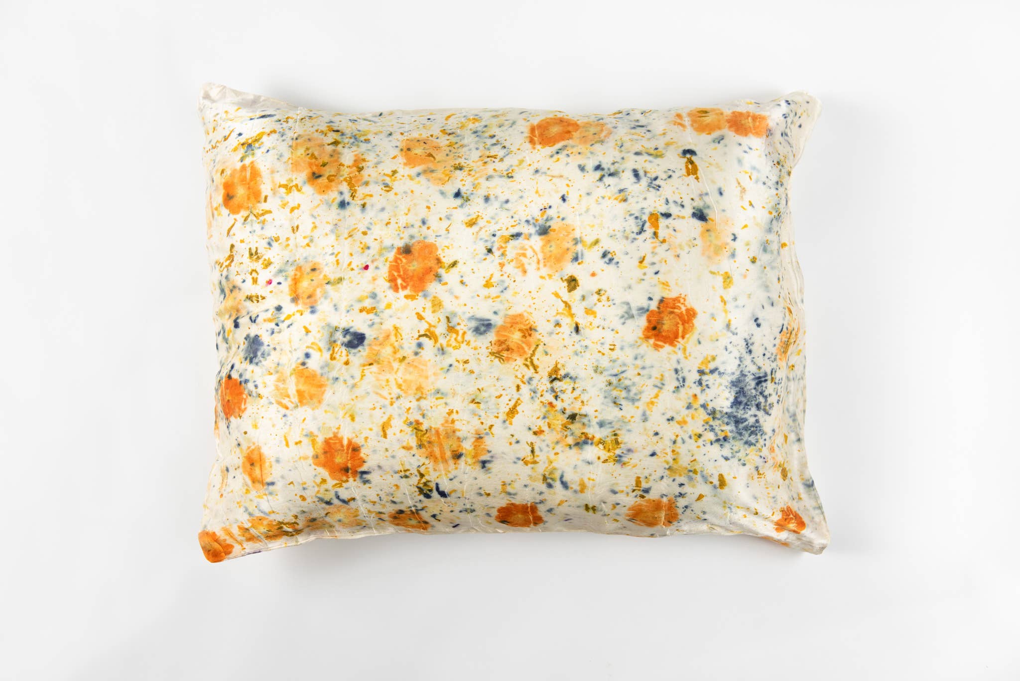 Floral-patterned pillow on a white background
