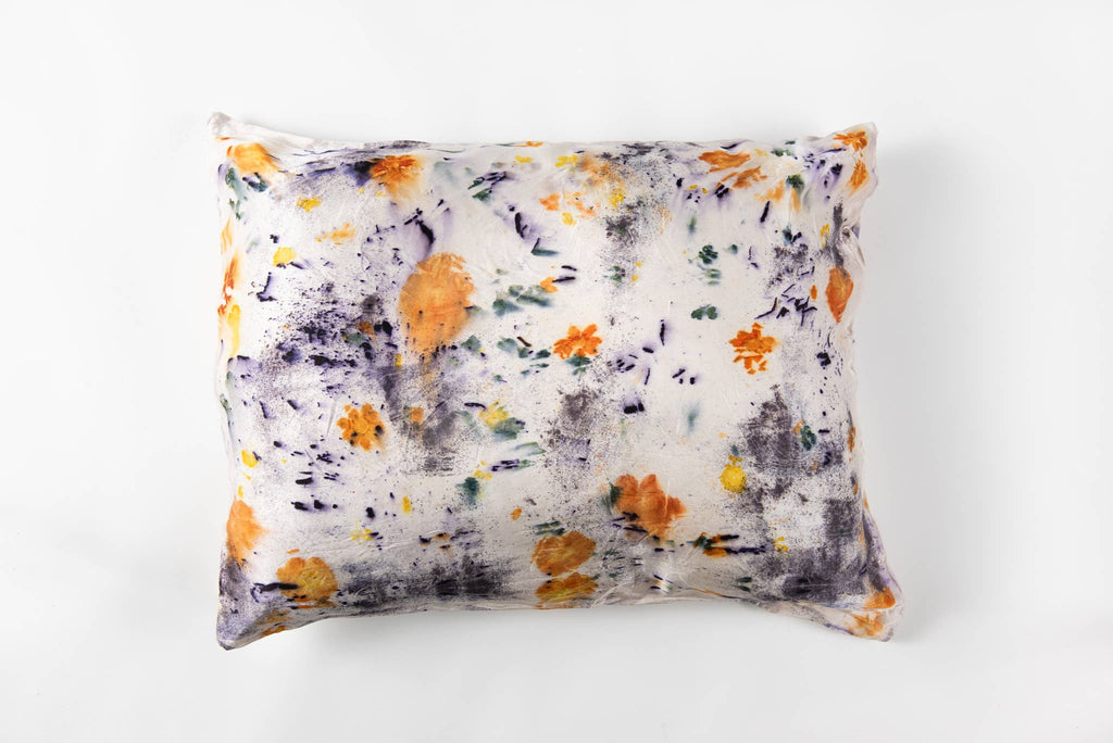 Floral-patterned pillow on a white background
