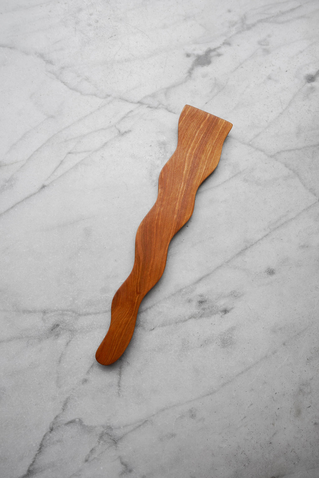 Wooden spatula on a marble surface