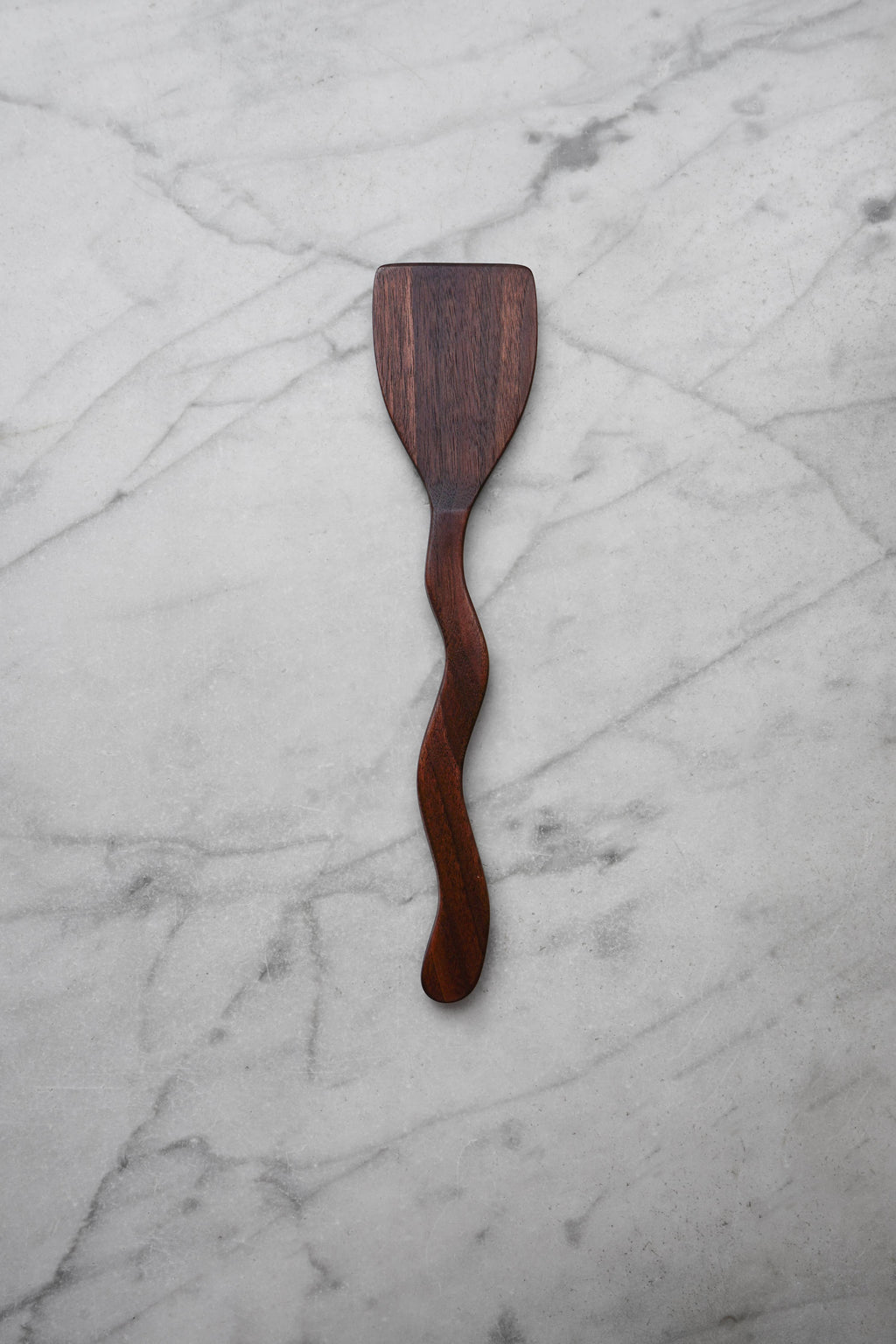 Wooden spatula on a marble surface