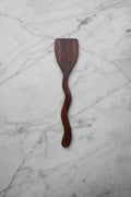 Wooden spatula on a marble surface