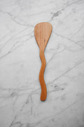 Wooden spatula on a marble surface