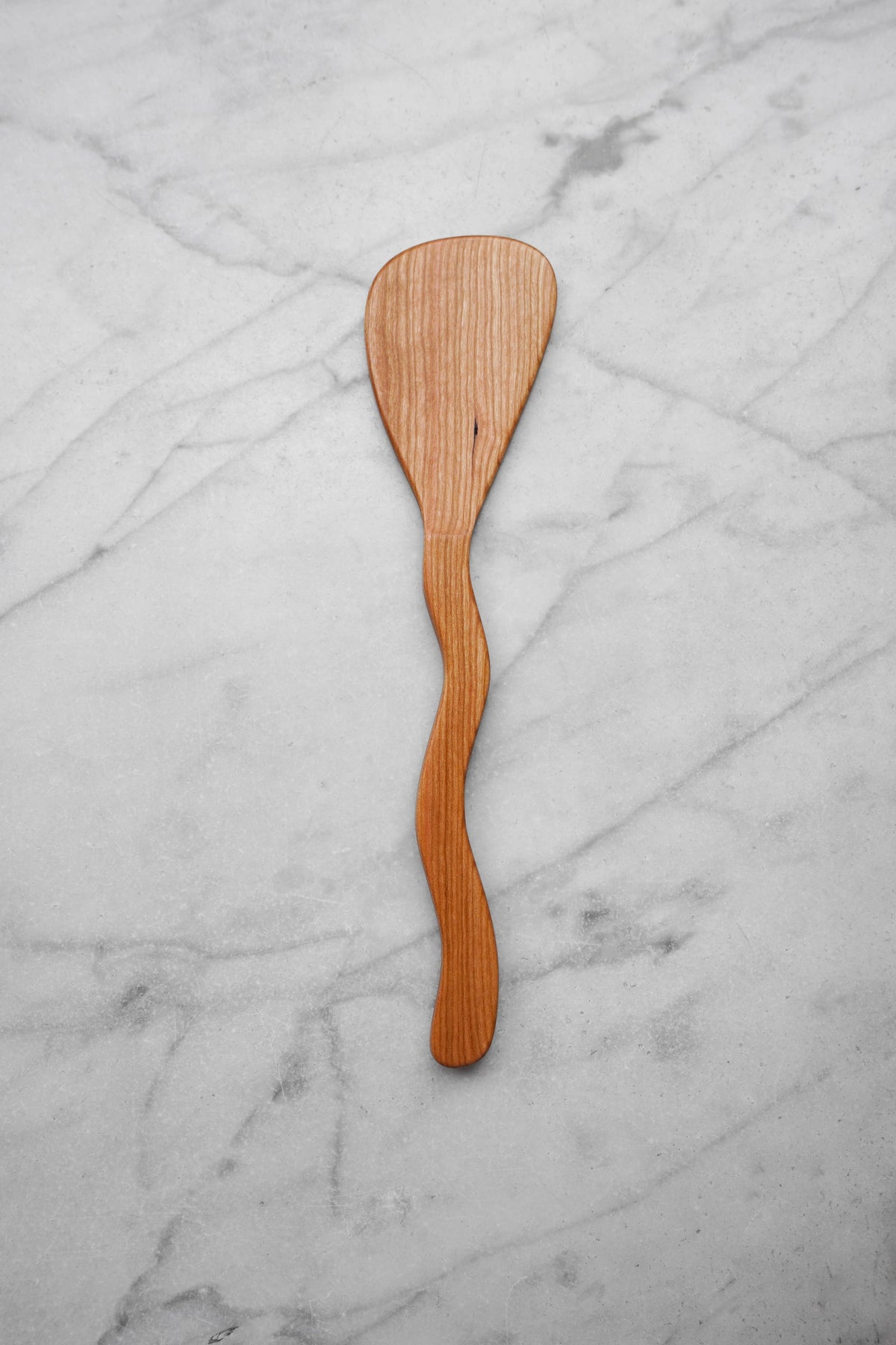 Wooden spatula on a marble surface