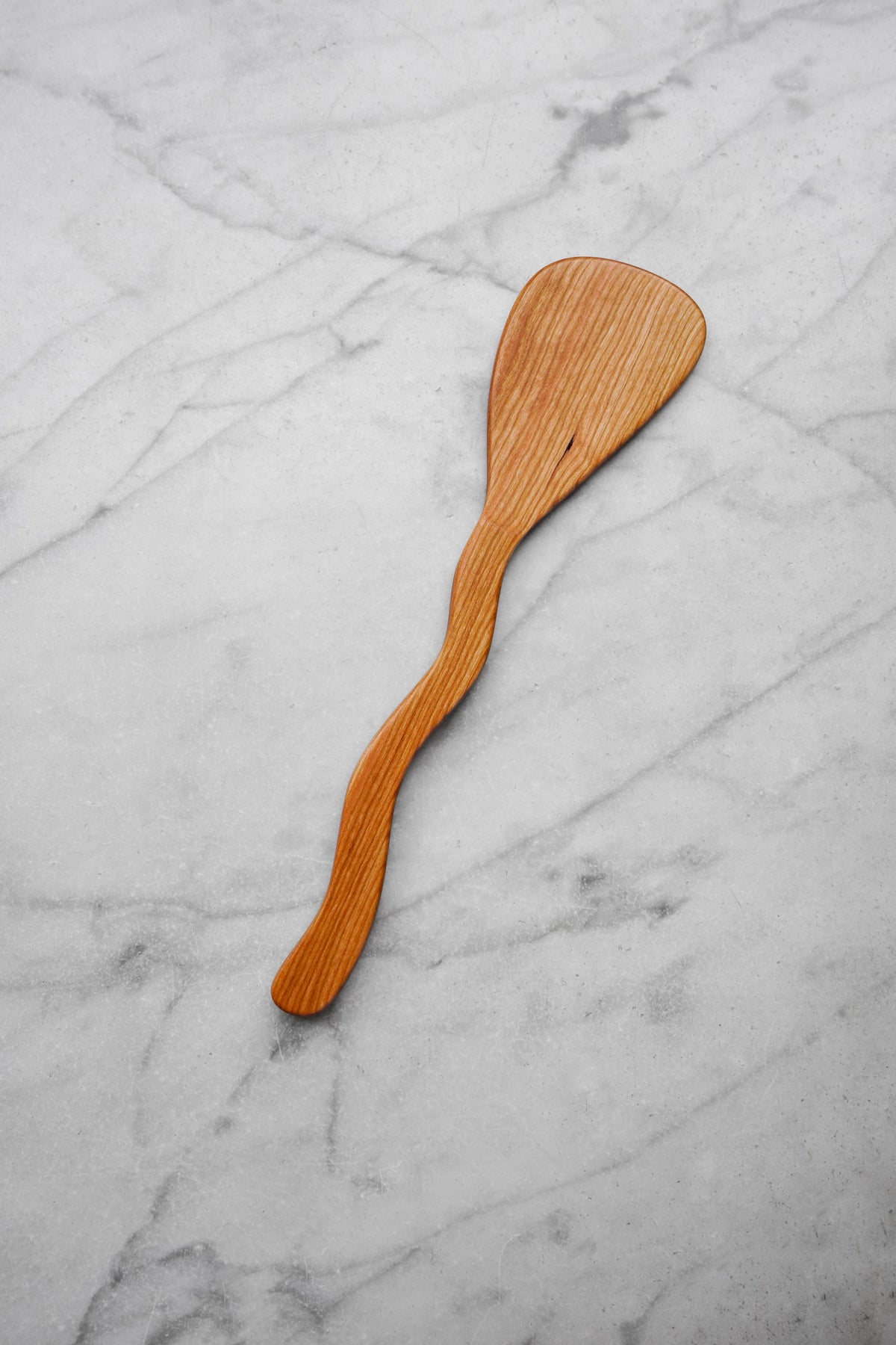 Wooden spatula on a marble surface