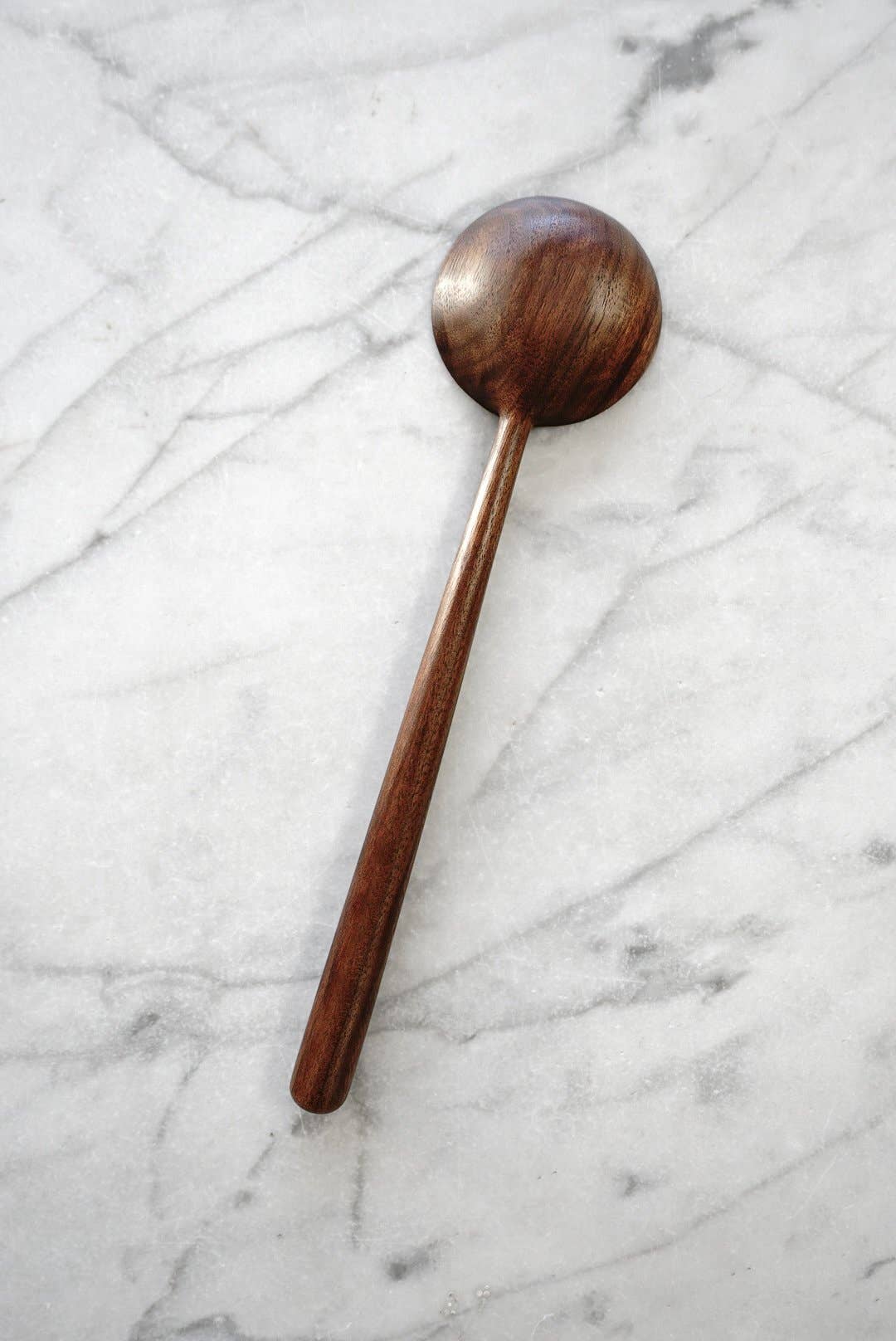 Wooden spoon on a marble surface