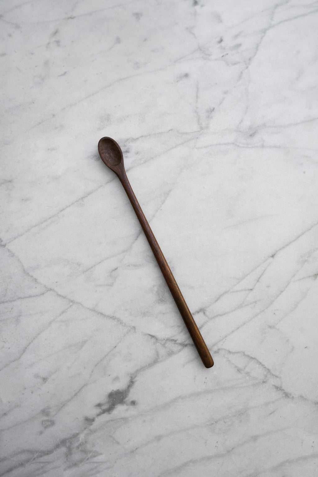 Wooden spoon on a marble surface