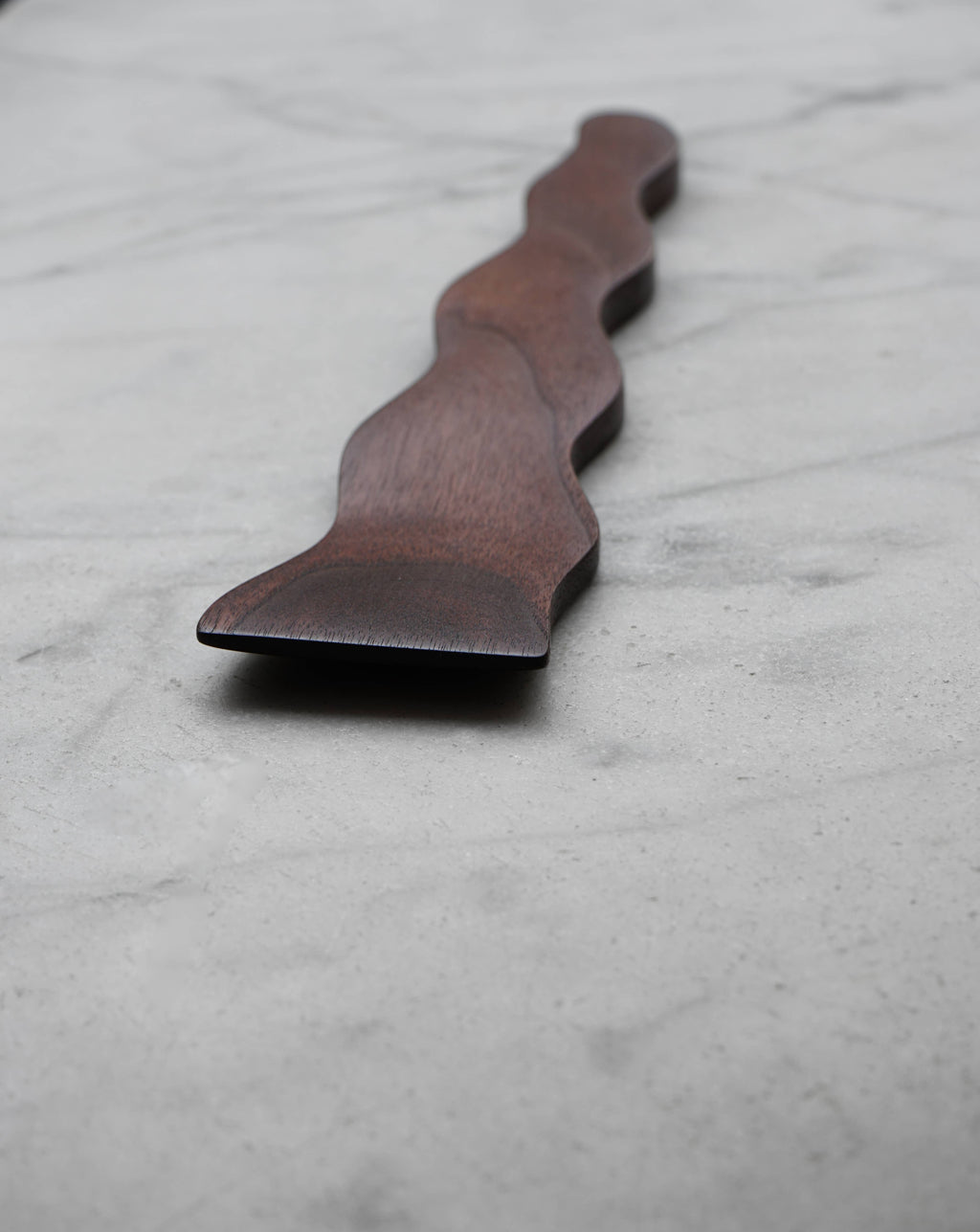 Wooden spatula on a marble surface