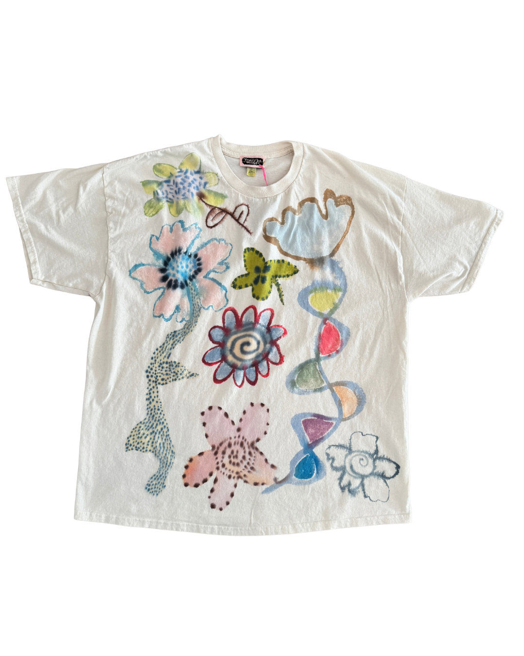 A white short-sleeve t-shirt featuring a colorful retro graphic print of flowers, a butterfly, and abstract shapes, laid flat against a white background.