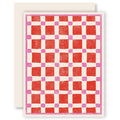 Checkered patterned card with red and pink squares on a white background