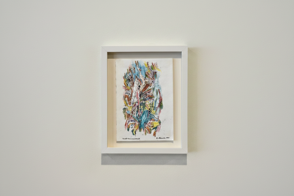 Framed abstract artwork on a plain wall
