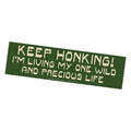 Green bumper sticker with white text on a white background