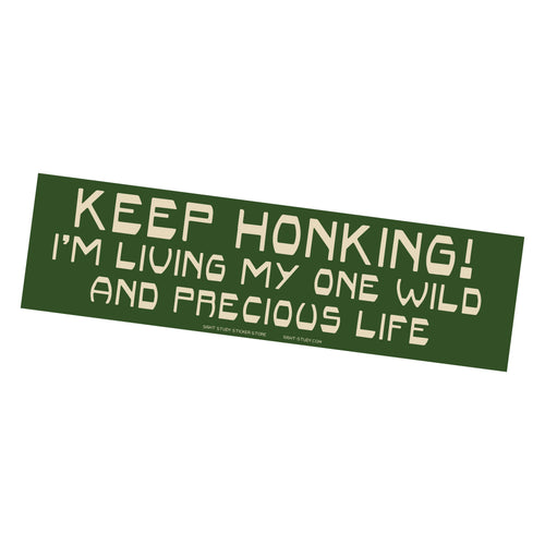 Green bumper sticker with white text on a white background