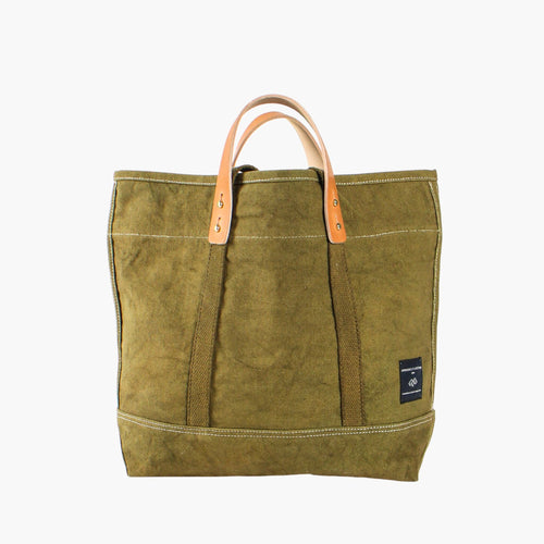 Green tote bag with leather handle on a white background