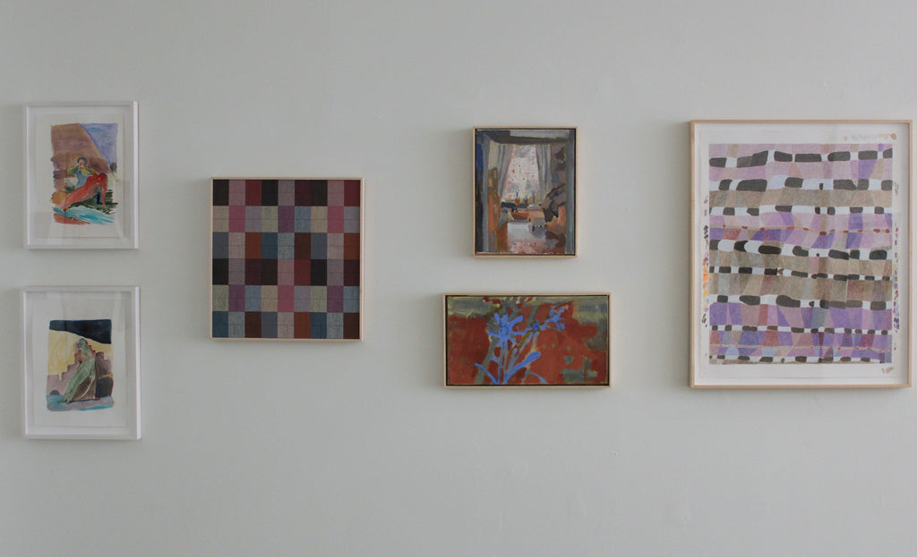 Collection of abstract artworks on a wall