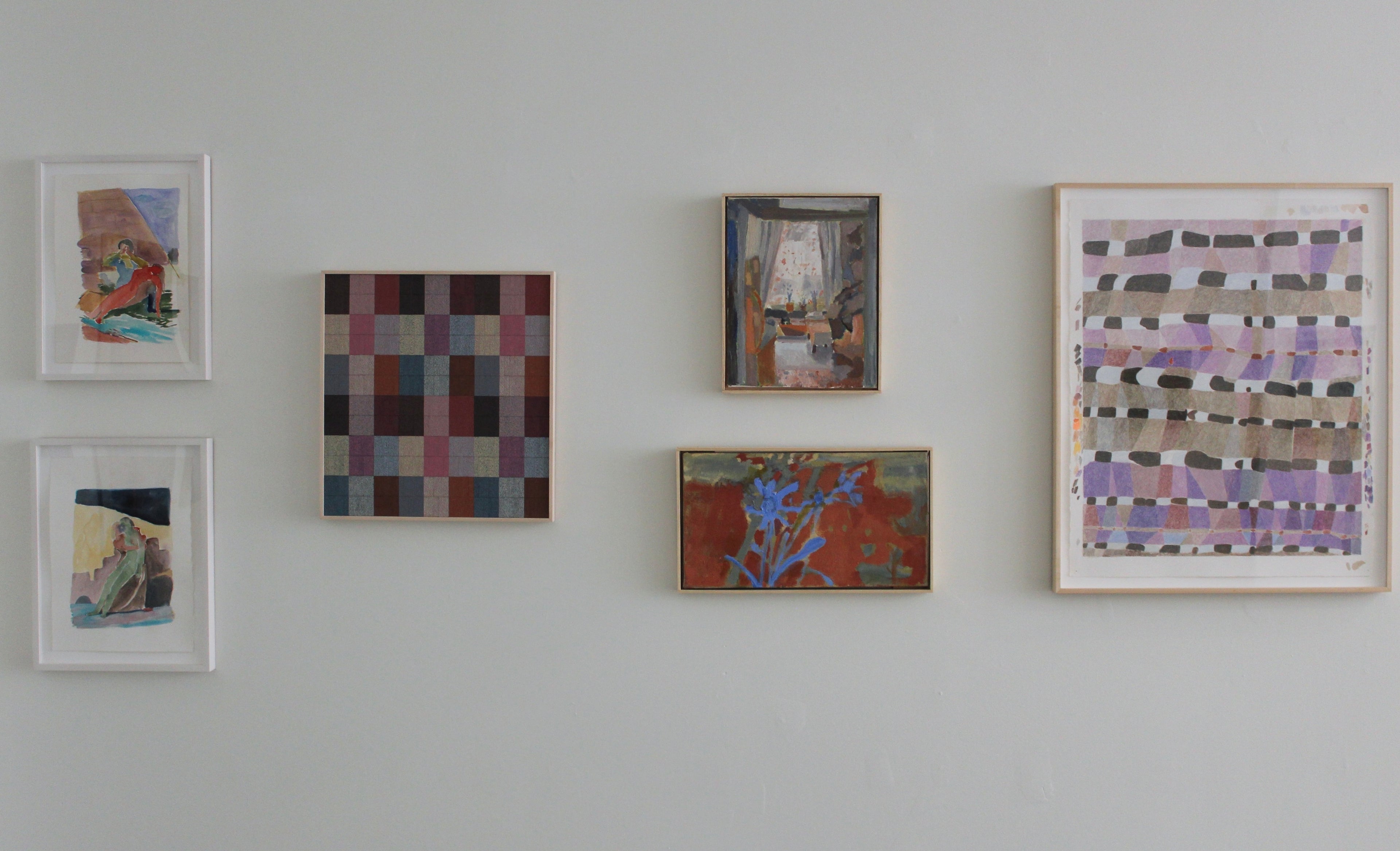 Collection of abstract artworks on a wall