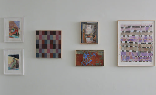 Collection of abstract artworks on a wall