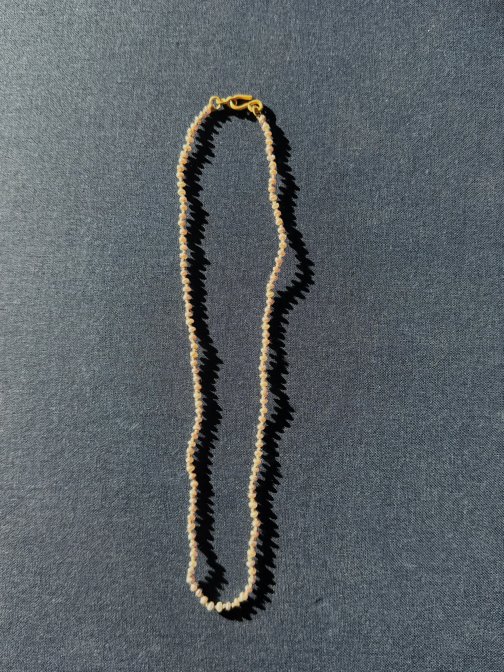 22k Small Grey Seed Pearl Strand