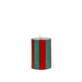 Striped red and green candle on a white background
