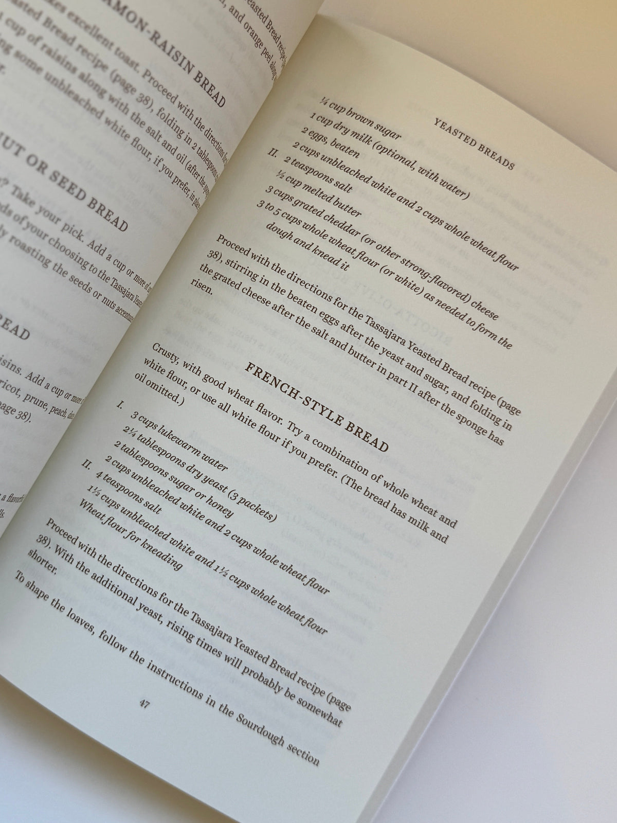 An open book with printed text spread across two pages, photographed from above on a plain white background.
